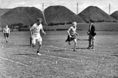 School sports with pit heaps in background