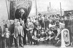 Wheatley Hill Colliery Band and Banner. May Day 1968 with the recently closed pit in the background